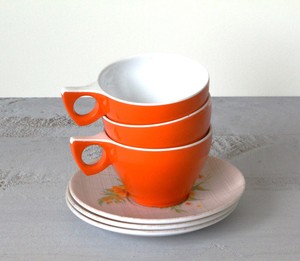 Products: Orange Duraware Cups with floral saucers 6 pieces
