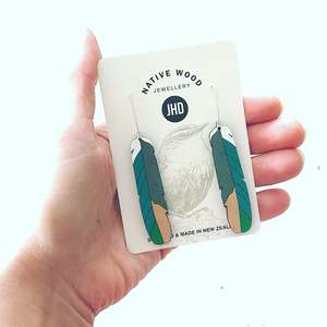 Earrings: Kererū  feather Rimu earrings