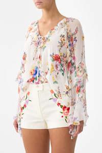 Lace up v-neck blouse with cascade ruffles