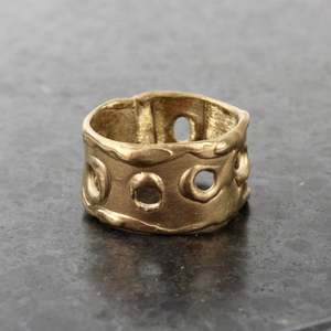 Melted holes bronze ring