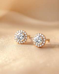 Earrings: Diamond Studs with Centre stone and small stone round cut style