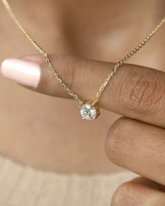 Frontpage: 0.52 Carat TW Round Lab Diamond Solitaire Pendant in 9K Yellow Gold
