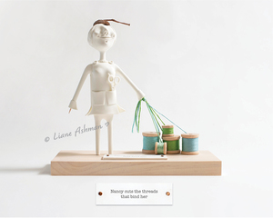 Products: Print: Nancy cuts the ties that bind her