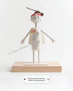 Products: Print: Molly awards herself the ‘Medal of Awesomeness’