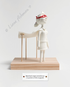 Print: Martha’s cape sometimes needs a little support