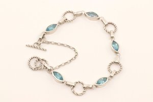 Products: Eye of the Storm Bracelet - STG Silver and Swiss Blue Topaz - LISA WEBB