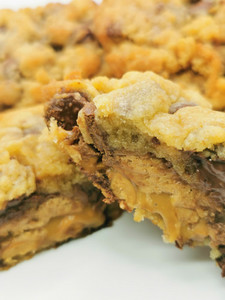 NYC Style Snickers Stuffed chocolate chip Cookies Hello Delicious