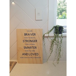 Baby: Braver Stronger Smarter and Loved Plywood Wall Sign