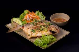 M25 - CRUNCHY GOLDEN PAMPANO FISH SERVED WITH GARLIC FISH SAUCE
