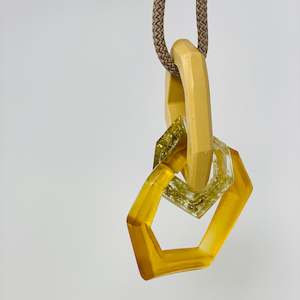 Featured Maca Links Neckwear: Links Pendant, light amber, gold glitter and beige
