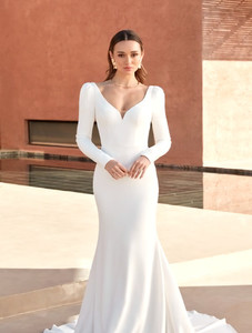 Products: Anders Madison Rose Bridal a modern fit n flare wedding gown with sweetheart bodice, long sleeves and flirty back