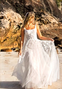 Products: Discover the stunning wedding dress Jayce ML22777 from Madi Lane now on SALE with her square bodice and slim a line skirt - Madison Rose Bridal