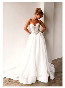Lux - modern princess with corset bodice and dropped v Tania Olsen MB2408