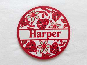 Round Name Plaques Made To Order In Any Name: Lady bug themed name plaque - Made to order in any name.