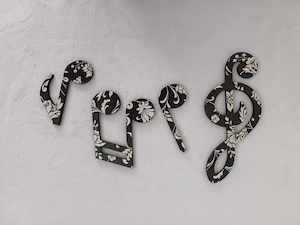 Miscellanous In Stock Items: Set of 4 music notes.