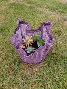 Handmade small cement planter with succulents.