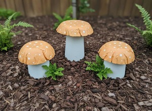 Set of 3 pastel orange concrete mushrooms.