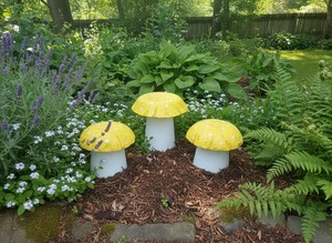 Garden Decor Pick Up Only: Set of 3 yellow concrete mushrooms.