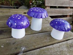 Set of 3 purple concrete mushrooms.