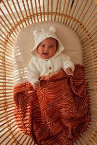 Awhi Manaaki Kokowai Knitted Pepi Blanket