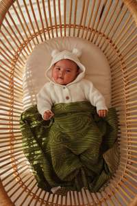 Awhi Ngahere Pepi Knitted Blanket