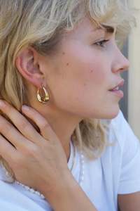 A C Oslo: Gold Steel Sculptured Earrings