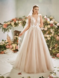 Soft tulle wedding gown with floral appliqued plunging bodice