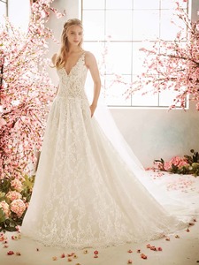 Products: Stunning fully laced A-line wedding gown with deep V neck