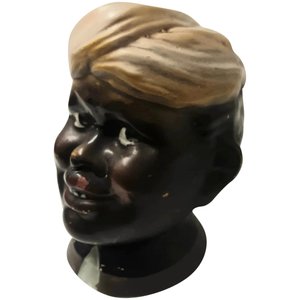 Products: English Porcelain Native Boy Penny Bank