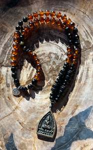 Malas: Mālā with Rare Blue Amber, Golden Sheen Obsidian and Onyx Beads with a Thai Buddha Pendant