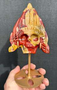 Mookaite Jasper carved Skull with Feathers on a stand