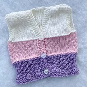 Outerwear: “Daisy” hand knit merino baby vest