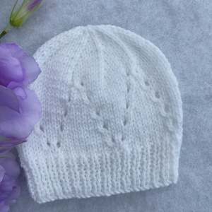Baby Hats And Booties: Eyelet merino baby hat