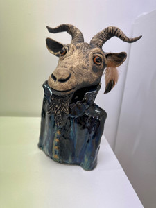 Products: Glazed ceramic goat figure Nelson City Framers