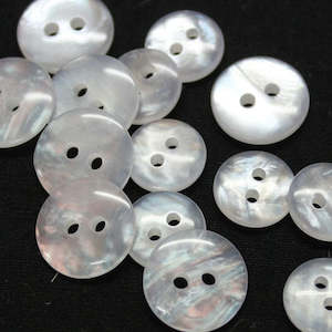 Buttons: Buttons - Round Polyester 11.5 mm with a slight swirl pattern