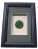 Framed jade koru