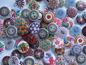 Buttons: 20 mixed print miscellaneous patterns. buttons 15mm 2 holes with white back.