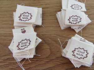 25 Hand made with a twig leaf border cotton flag labels. 2 x 2cm