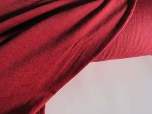 85 To 100 Merino Fabrics: 29cm Russett Red 120g 85% merino 15% core spun nylon jersey knit 150cm