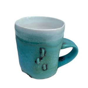 Turquoise Cup with X and 3 Staples