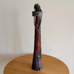 Sculptors: Tall Ceramic Lady | Matt Coppery Dress | Green Earrings