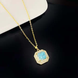 Elegant Aqua Crystal and Sterling Silver Necklace with Gold Plating