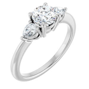 Moissanite Engagement Rings: Continuum Silver Round Brilliant Moissanite Three Stone Engagement Ring