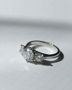 Stelle Round Brilliant Diamond Three Stone Engagement Ring