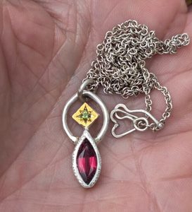 Products: Balancing act necklace. 12x5mm rhodolite garnet, unheated sapphire, silver and 24ct gold. Length 46.5cm - Penelope Barnhill Jewellery