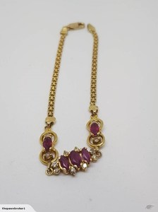 Products: Stunning Ruby And Diamond Bracelet in 14K Yellow Gold (Valuation .00)
