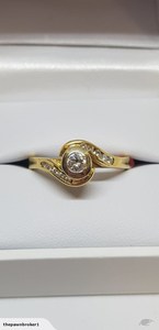 18k Solitaire Diamond Ring With Diamonds Either Side With Val of $3,300.00