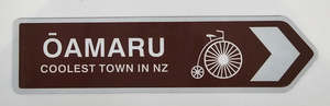 Souvenir Collection: Oamaru - Coolest Town Sign Magnet - Brown with Penny Farthing
