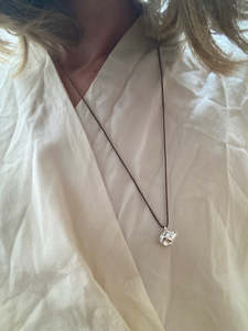 Silver Conch on Brown Silk Necklace