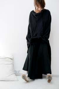 Charcoal merino jumper with blue panel at front / Black patched skirt with pleats